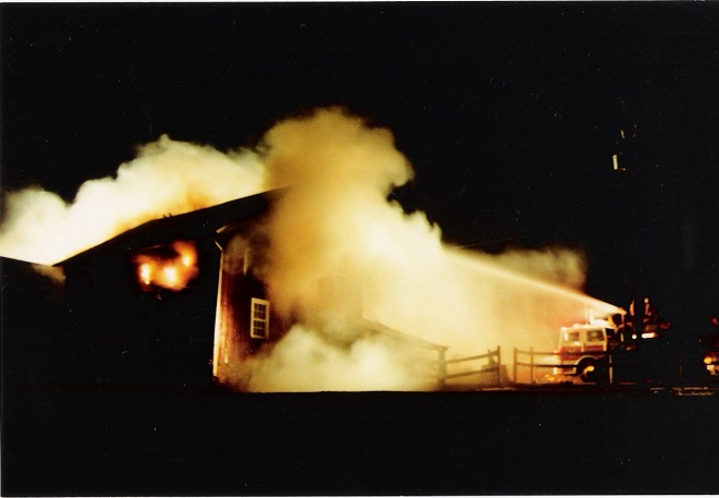 An engine company initiates a Blitz Attack to extinguish a fire in a barn.