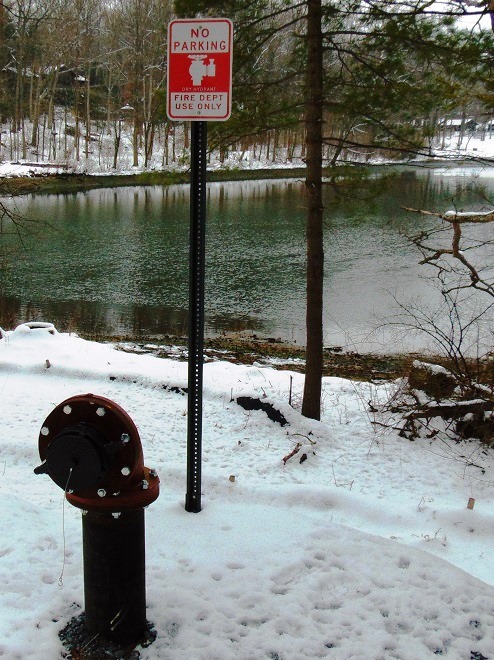 A dry hydrant installed to use water from a lake for rural firefighting.
