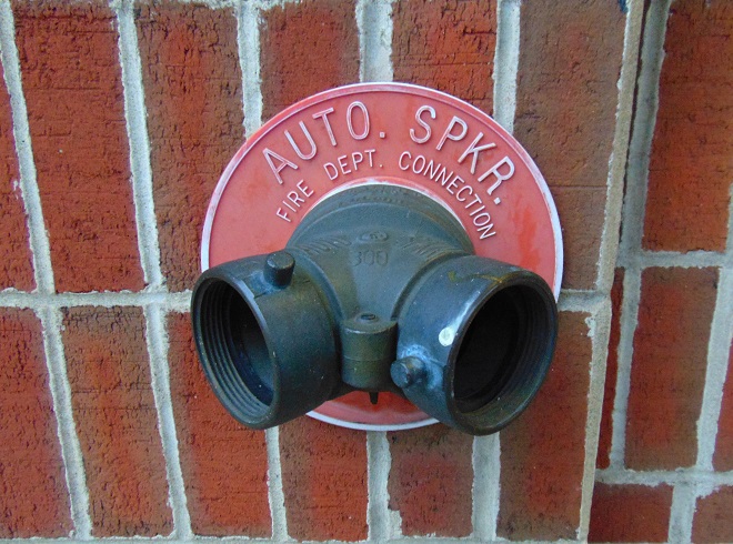 A fire department connection for an automatic sprinkler system.
