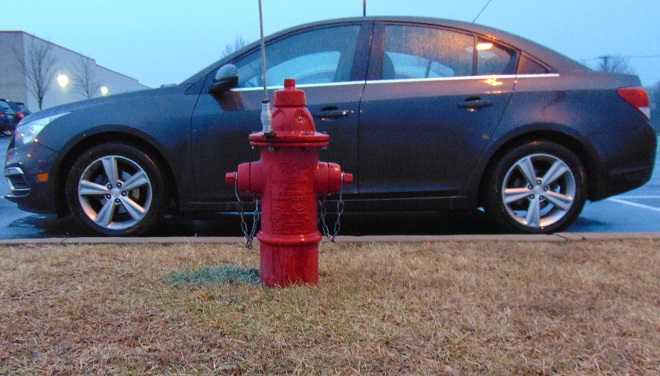 Automobile blocking fire hydrant.