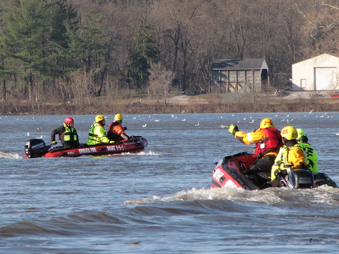 A water rescue team drilling in cold weather.